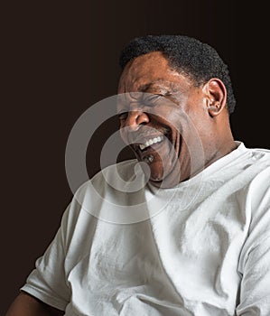 Middle aged African American man laughing