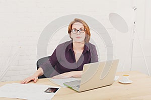 Middle-aged architect woman in the office