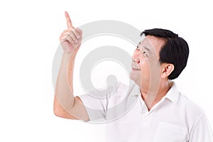 Middle aged asian man pointing up to blank space