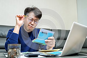 Middle-aged Asian man preparing for tax return.