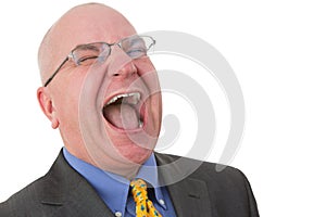 Middle-aged bald businessman laughing out loud