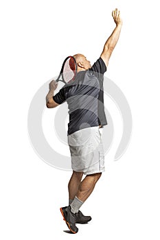 A middle-aged bald man plays tennis. Lefty. Isolated on a white background.