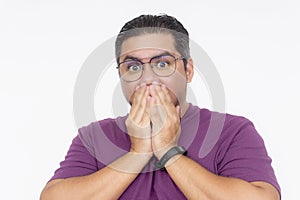A middle aged bespectacled man gasping in fear. Wearing a purple waffle shirt, isolated on a white background