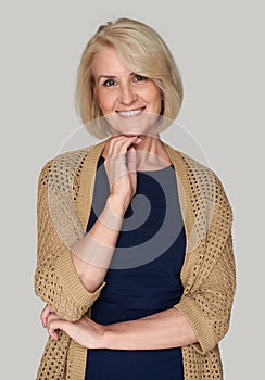 Middle aged blonde woman smiling. Isolated