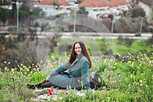 Middle-aged brunette woman on the background of beautiful nature