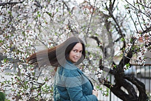 Middle-aged brunette woman on the background of beautiful nature