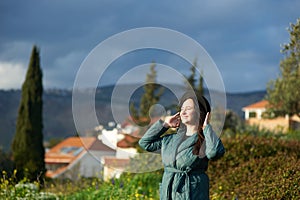 Middle-aged brunette woman on the background of beautiful nature