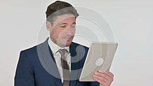 Middle Aged Businessman Celebrating on Tablet, White Background