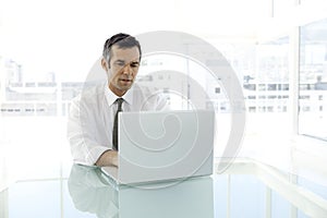 Middle-aged businessman at workplace