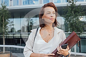 Middle-aged businesswoman outdoors