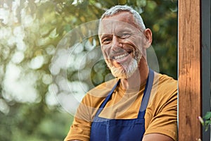 Middle aged caucasian businessman standing in garden