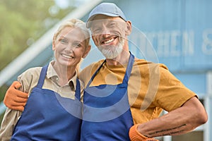 Middle aged caucasian man and woman standing together