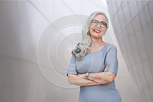 Middle-aged confident businesswoman, coach, CEO, owner, founder, corporation leader,  standing portrait