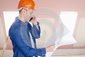 Construction worker consulting with somebody