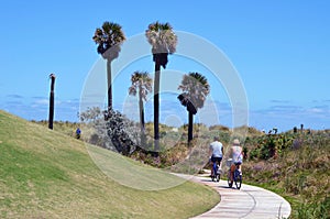 Middle aged couple bicycling at Southpointe Park Beach in