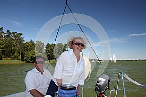 Middle-aged couple on boat sailing