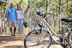 Middle-aged couple cycling