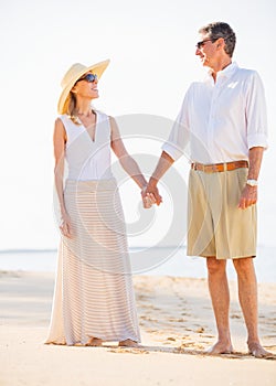 Middle Aged Couple Enjoying Walk on the Beach