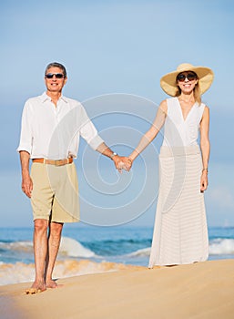 Middle Aged Couple Enjoying Walk on the Beach