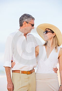 Middle Aged Couple Enjoying Walk on the Beach