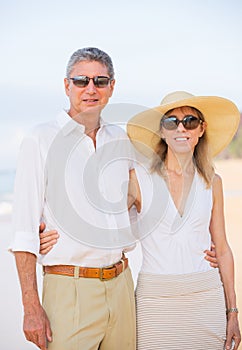 Middle Aged Couple Enjoying Walk on the Beach