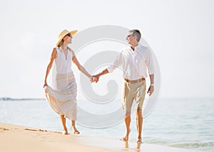 Middle Aged Couple Enjoying Walk on the Beach