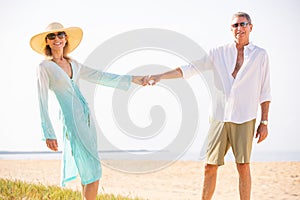 Middle Aged Couple Enjoying Walk on the Beach