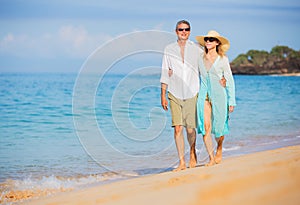 Middle Aged Couple Enjoying Walk on the Beach