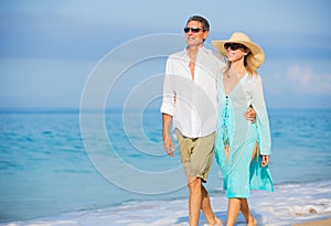 Middle Aged Couple Enjoying Walk on the Beach