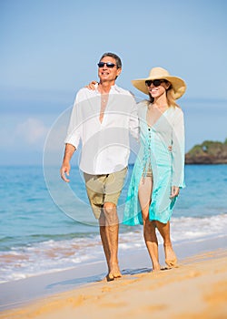 Middle Aged Couple Enjoying Walk on the Beach