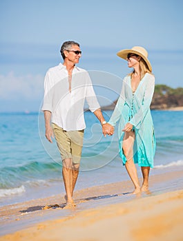 Middle Aged Couple Enjoying Walk on the Beach