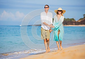 Middle Aged Couple Enjoying Walk on the Beach