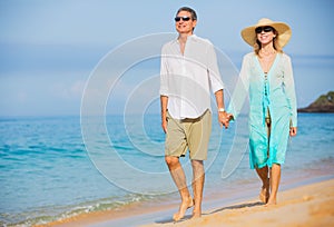 Middle Aged Couple Enjoying Walk on the Beach