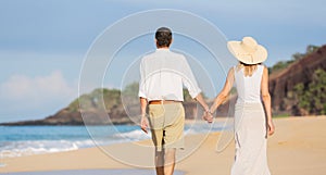 Middle Aged Couple Enjoying Walk on the Beach