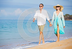 Middle Aged Couple Enjoying Walk on the Beach