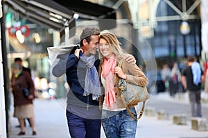 Middle-aged couple hanging out in the streets shopping