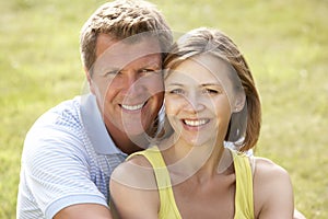 Middle aged couple having fun in countryside