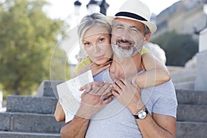 middle-aged couple hugging outdoors