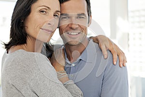 Middle aged couple in love hugging - close up