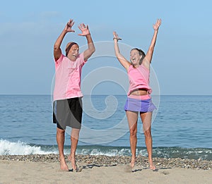 Middle aged couple on sandy beach