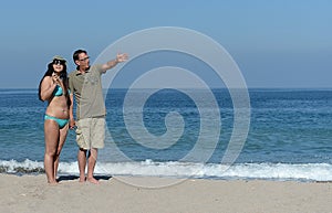 Middle aged couple on sandy beach