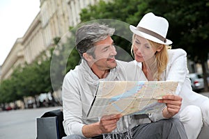 Middle-aged couple sightseeing the town