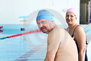 Middle Aged Couple In Swimming Pool