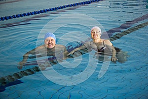 Middle Aged Couple In Swimming Pool