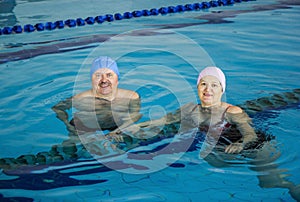 Middle Aged Couple In Swimming Pool