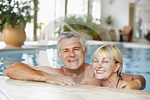 Middle Aged Couple In Swimming Pool