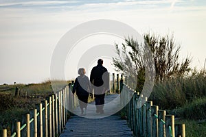 Middle-Aged Couple Walks on Boardwalk