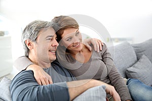 Middle-aged couple watching tv