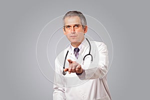 Middle aged doctor gesturing with copy space