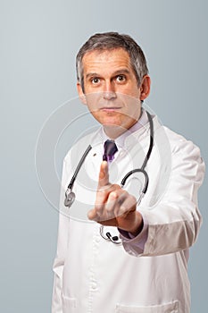 Middle aged doctor gesturing with copy space